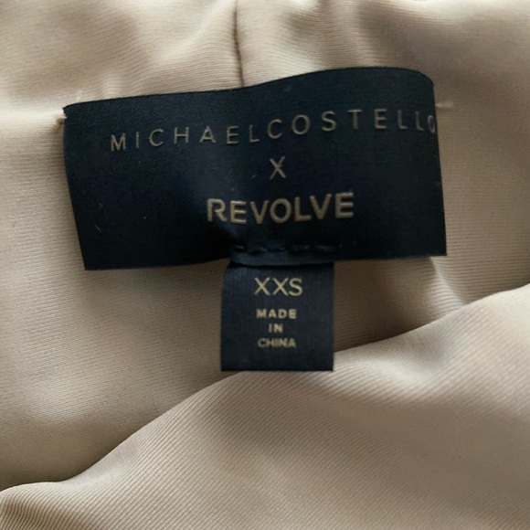 X REVOLVE FIJI MIDI DRESS IN TAUPE
Michael Costello - Picture 6 of 6